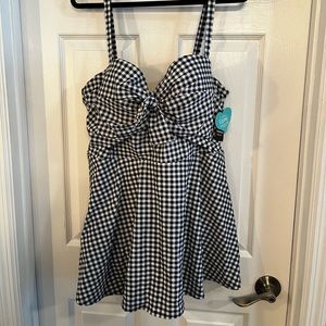 Torrid one piece dress swimsuit with built in bra/underwire.